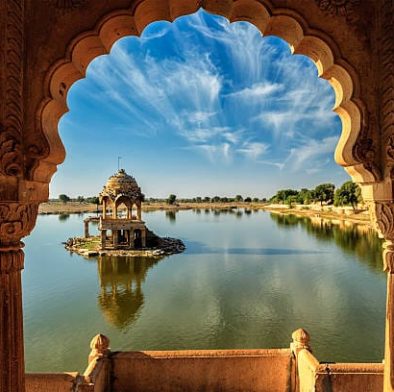 Indian landmark Gadi Sagar - artificial lake view through arch. Jaisalmer, Rajasthan, India